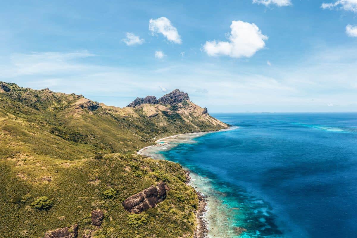 A mountainous, rugged coastline along tropical Waya island in Fiji