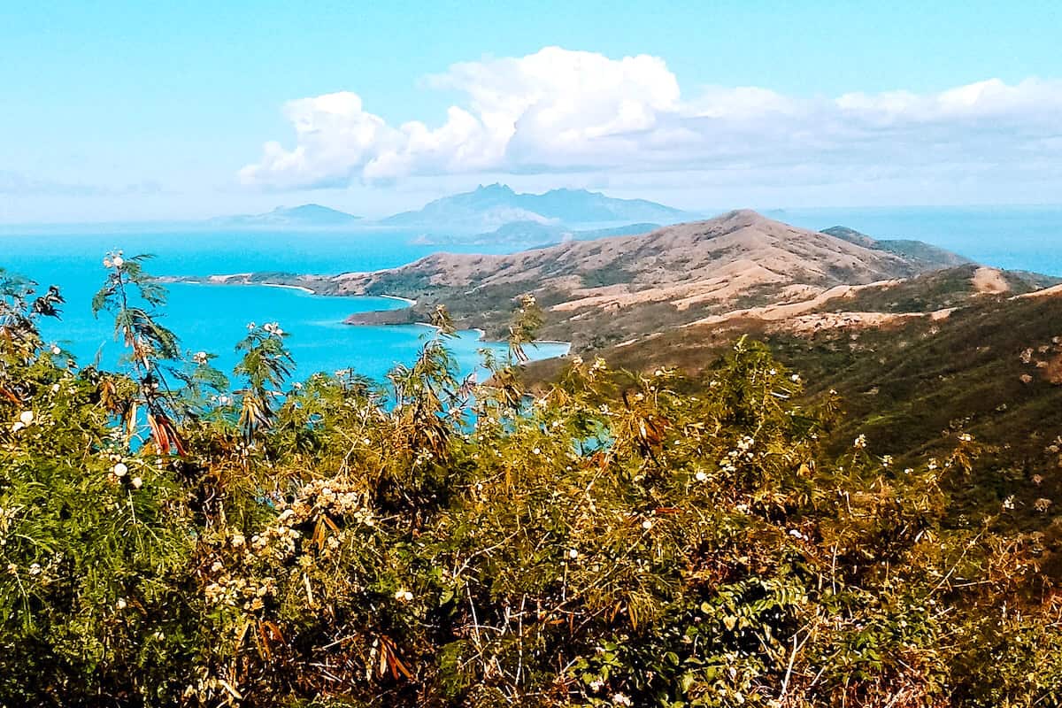 A view across hilly, tropical terrain on an island in Fiji