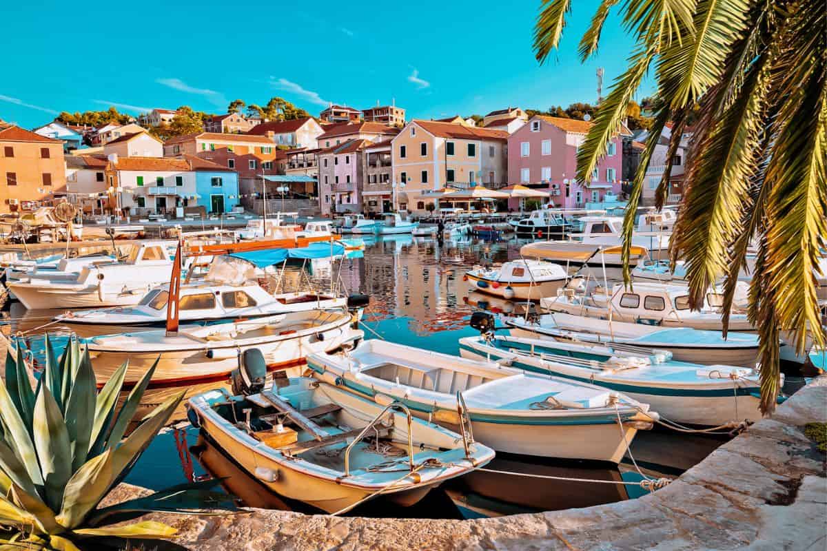 Lots of little boats in a harbour in a colourful village in Dugi Otok in Croatia