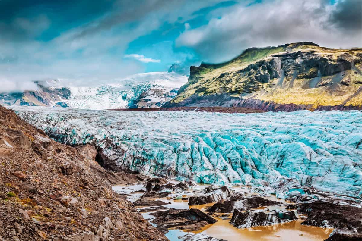 A glacier in Iceland surrounded by mountain scenery