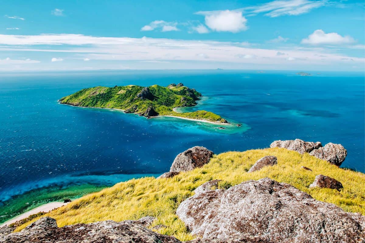 A viewpoint looking towards the small tropical island of Kuata in Fiji