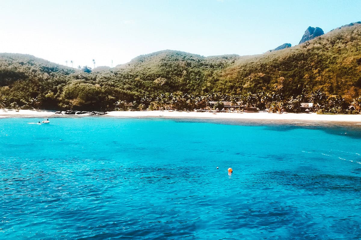 A view towards a tropical island resort in the Yasawa region in Fiji
