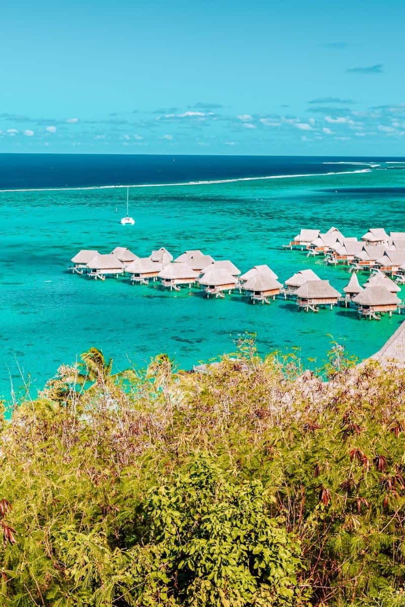 Turquoise tropical seas with overwater bungalows in French Polynesia