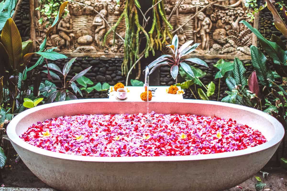 A bathtub filled with pink petals in Bali