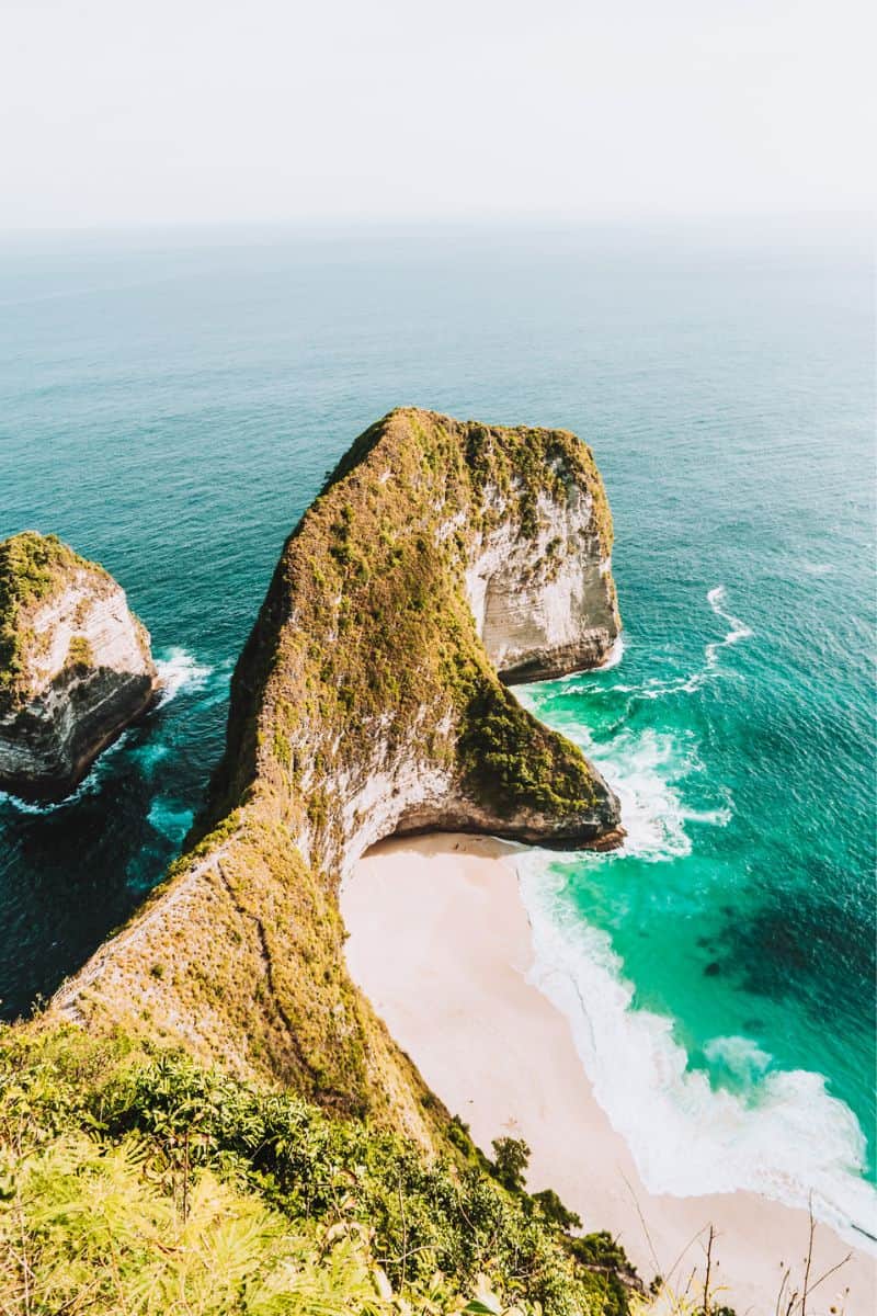 A viewpoint overlooking a coastal cliff that's shaped like a T-Rex head