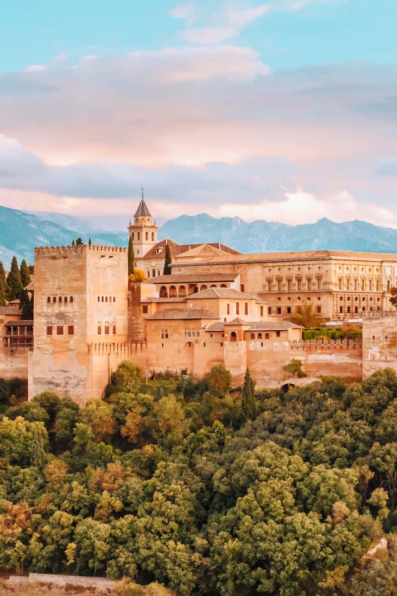 A view towards grand, golden palace buildings in Alhambra in Granada, Spain