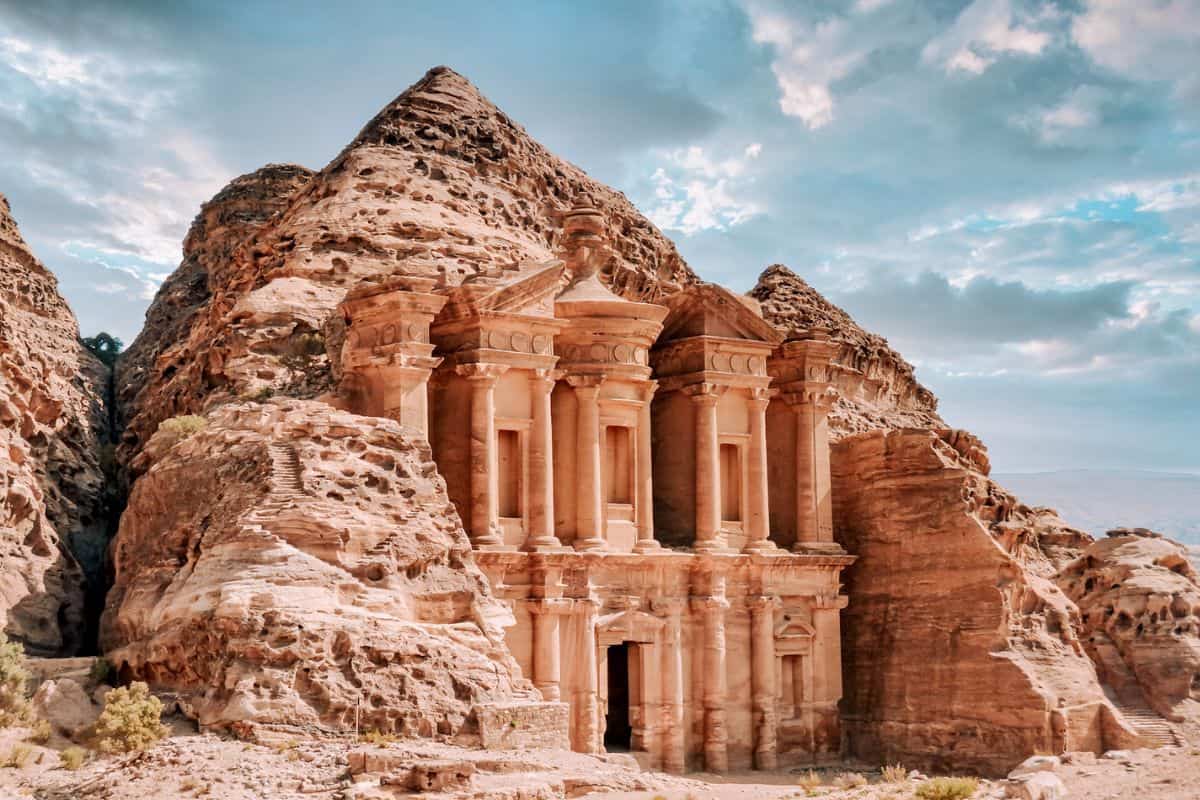 A building carved out of rock in the ancient city of Petra, Jordan