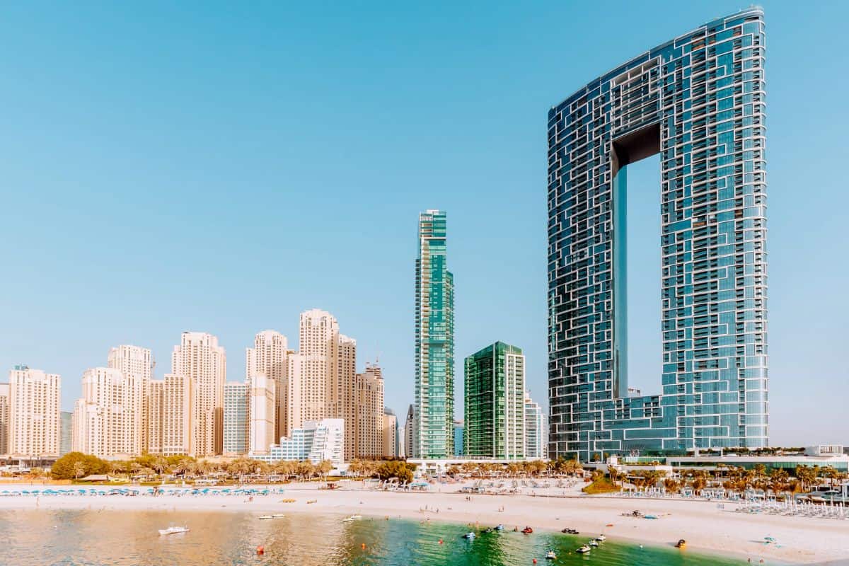 A beach in Dubai backed by modern skyscrapers