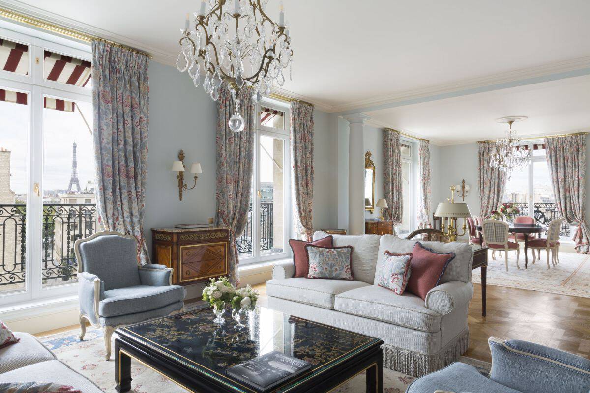 A romantic and elegant suite in a luxury hotel in Paris with windows overlooking the Eiffel Tower