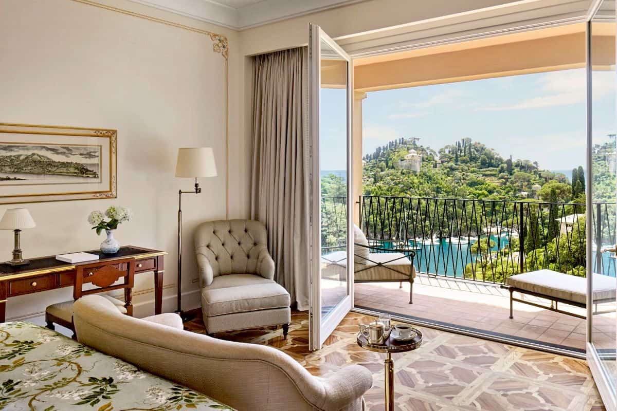 A quaint and romantic hotel suite with a private balcony overlooking the sea in Portofino, Italy