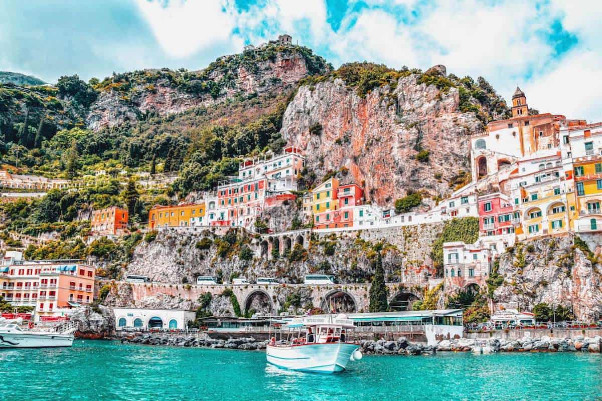 Colourful buildings set in a cliff above the sea on Italy's Amalfi Coast