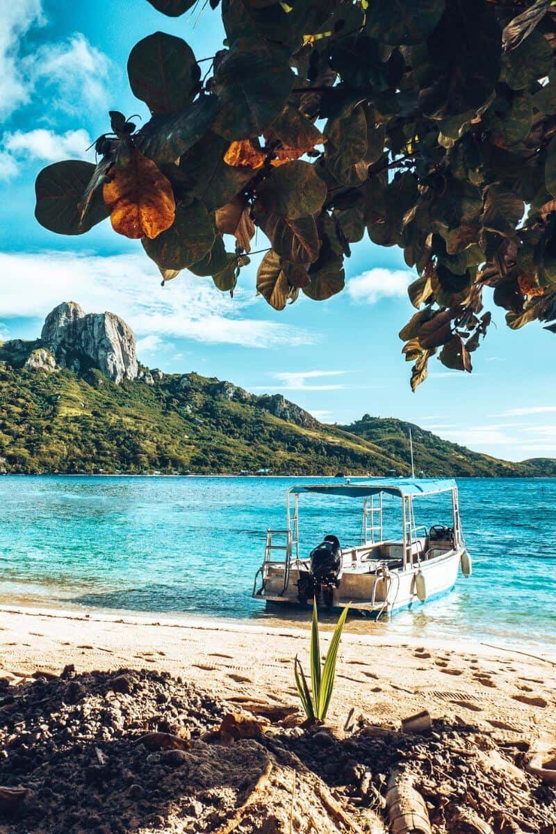 A small boat on the beach of a tropical island in Fiji