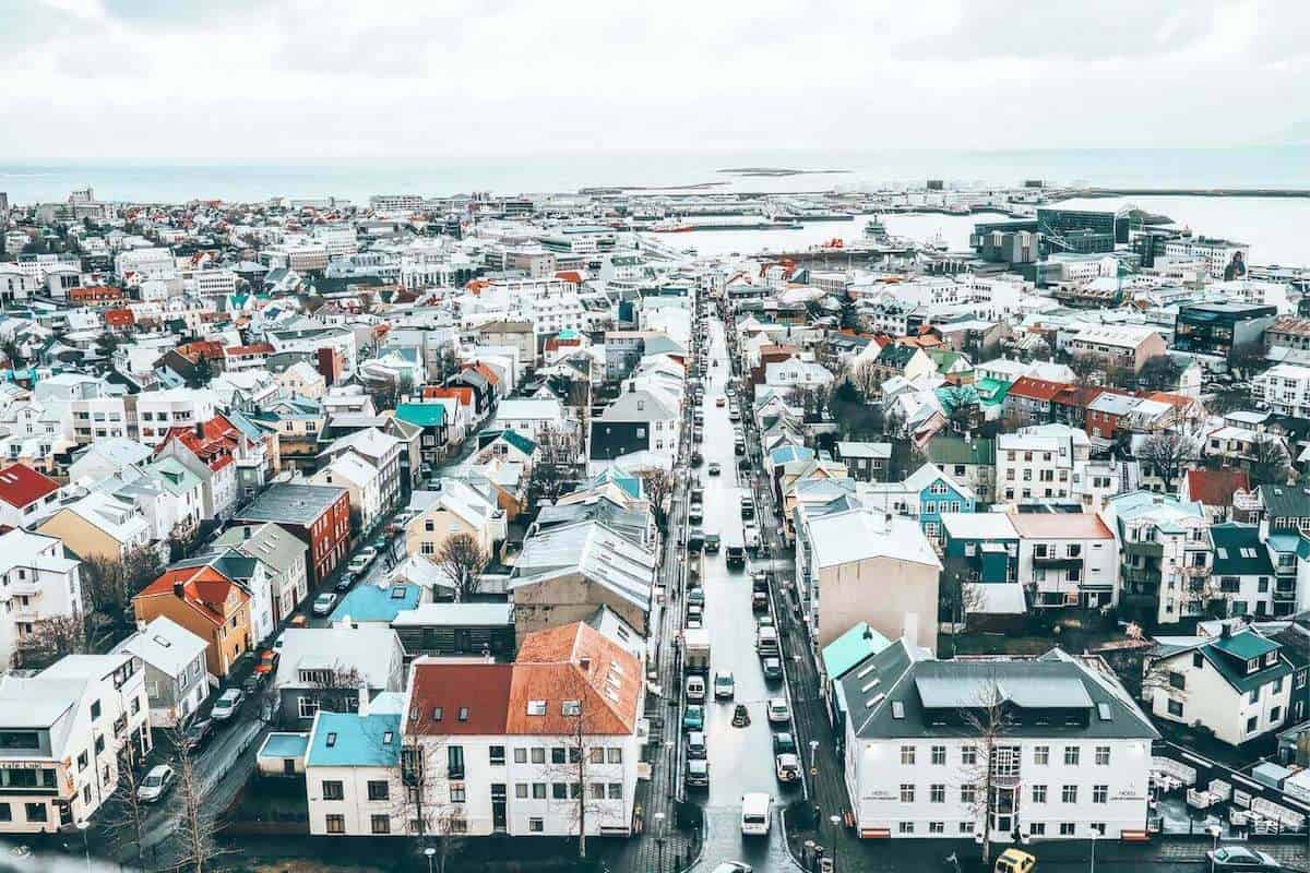 A view across the city of Reykjavik in winter with colourful buildings and grey skies