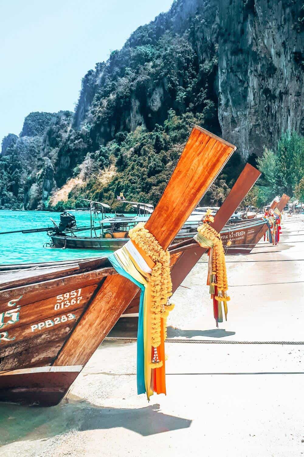Close up of wooden longtail boats on the beach in Thailand