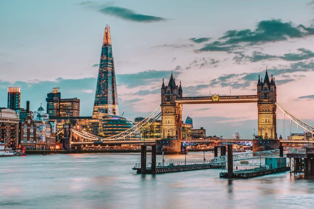 A sunset view across the river in London looking towards Tower Bridge and the Shard