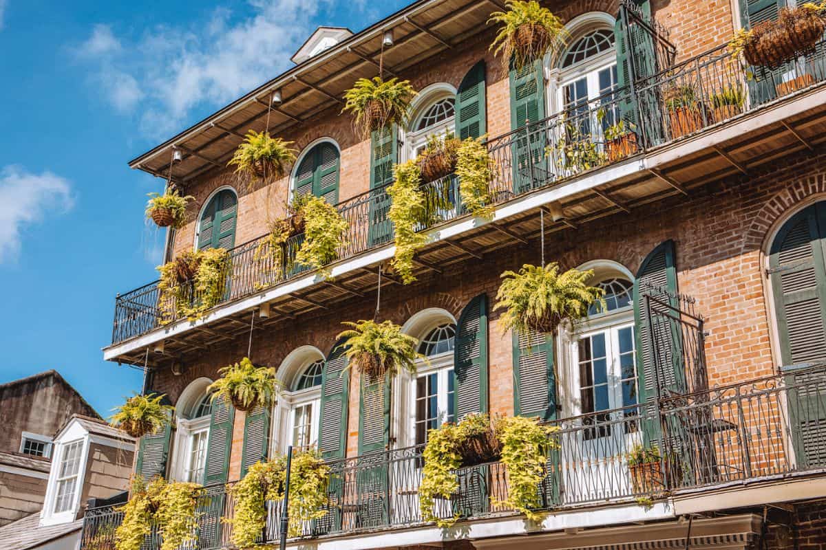 A close up of a building with French-style shutters in New Orleans