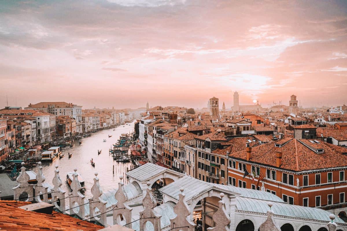 A view across rooftops and the Grand Canal in Venice from the Fondaco dei Tedeschi Rooftop