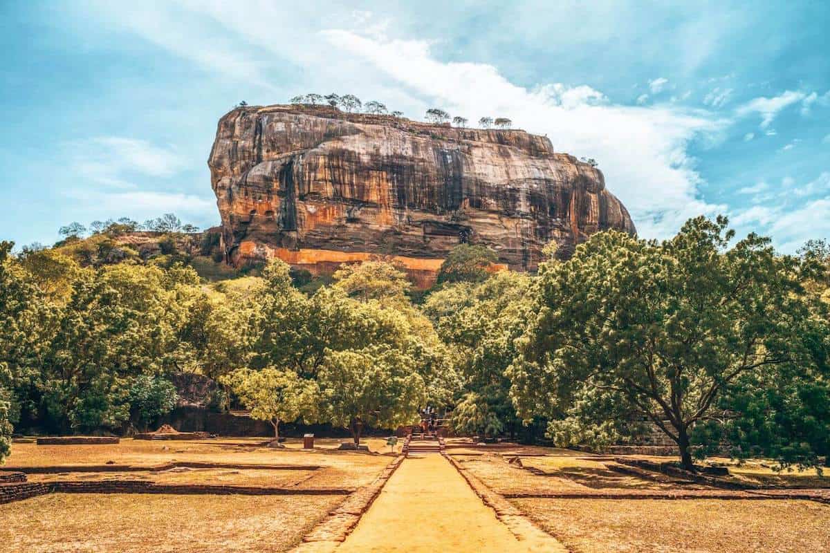 A path leading towards the towering rock fortress of Sigiriya in Sri Lanka