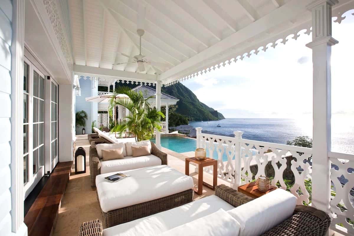 An outdoor terrace at a luxury resort in St Lucia overlooking the sea