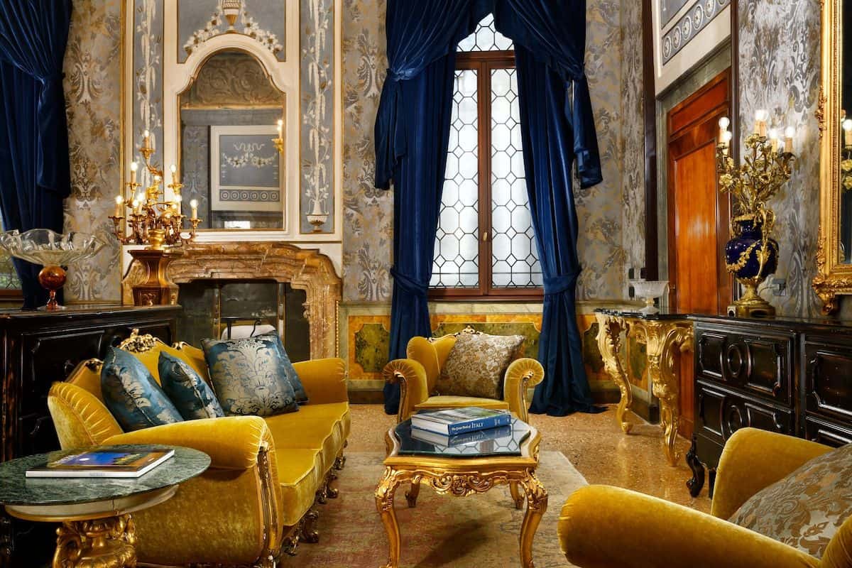 An ornate gold and blue suite at a luxury hotel in Venice