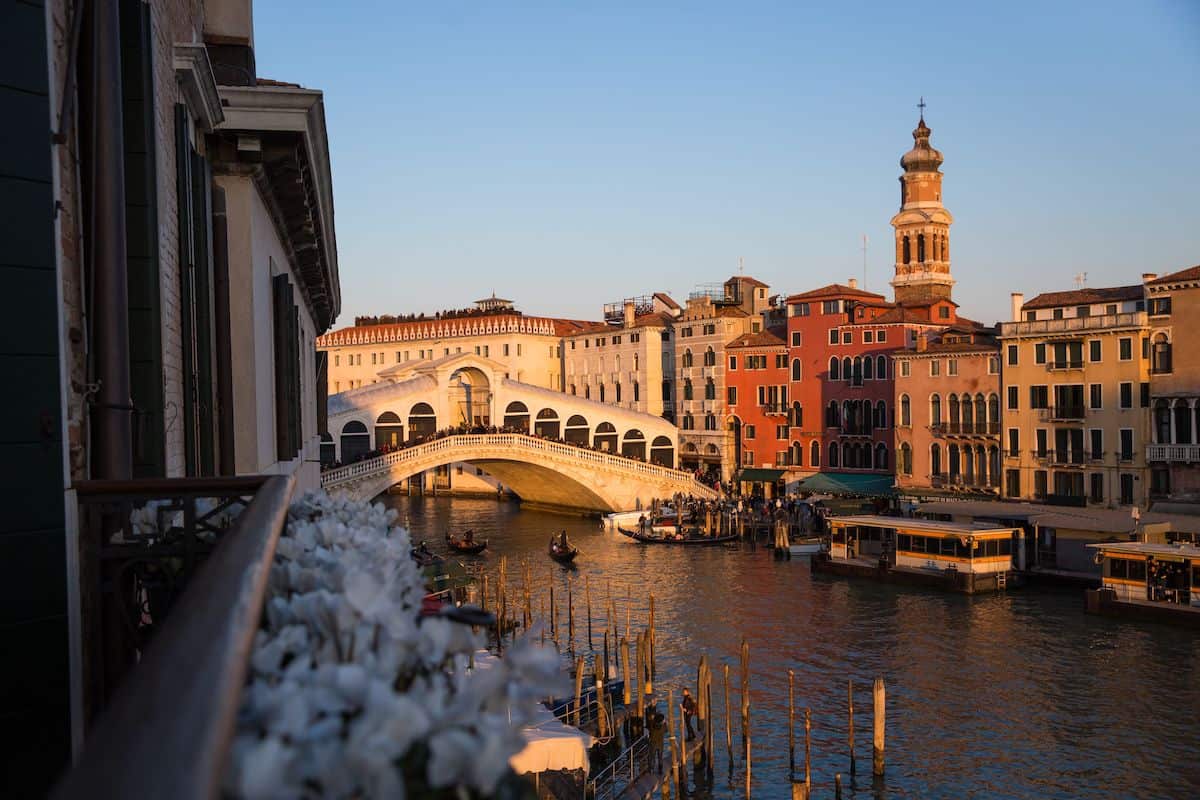 A view from a hotel window overlooking the Grand Canal and Rialto Bridge in Venice, Italy