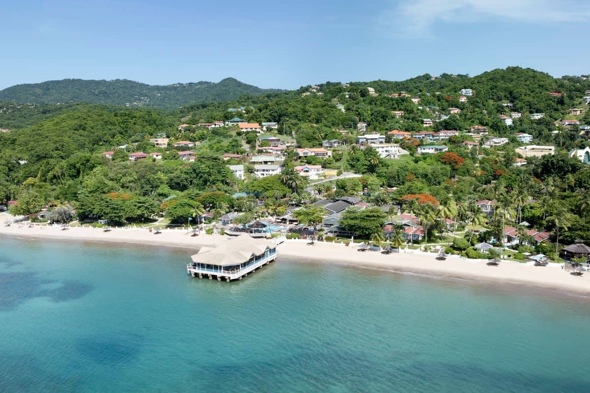 A resort in the Caribbean set on a stretch of white sand beach