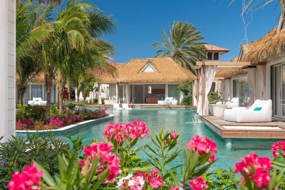 Rustic luxury accommodation around a swim-up pool in the Caribbean