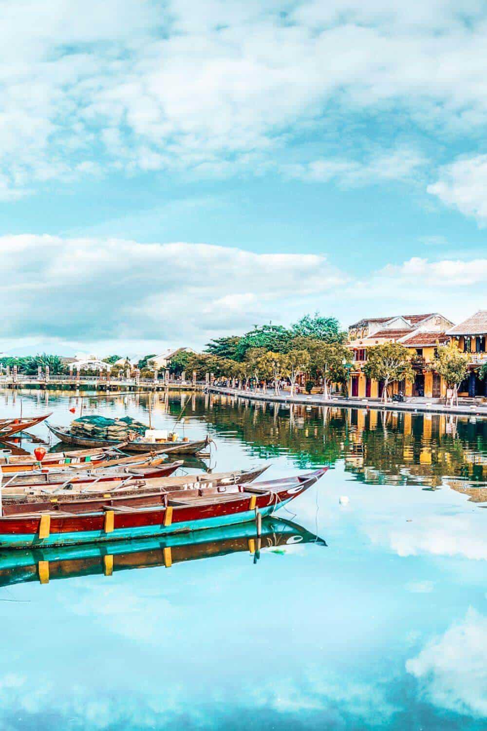 Traditional wooden boats on a canal in Hoi An, Vietnam