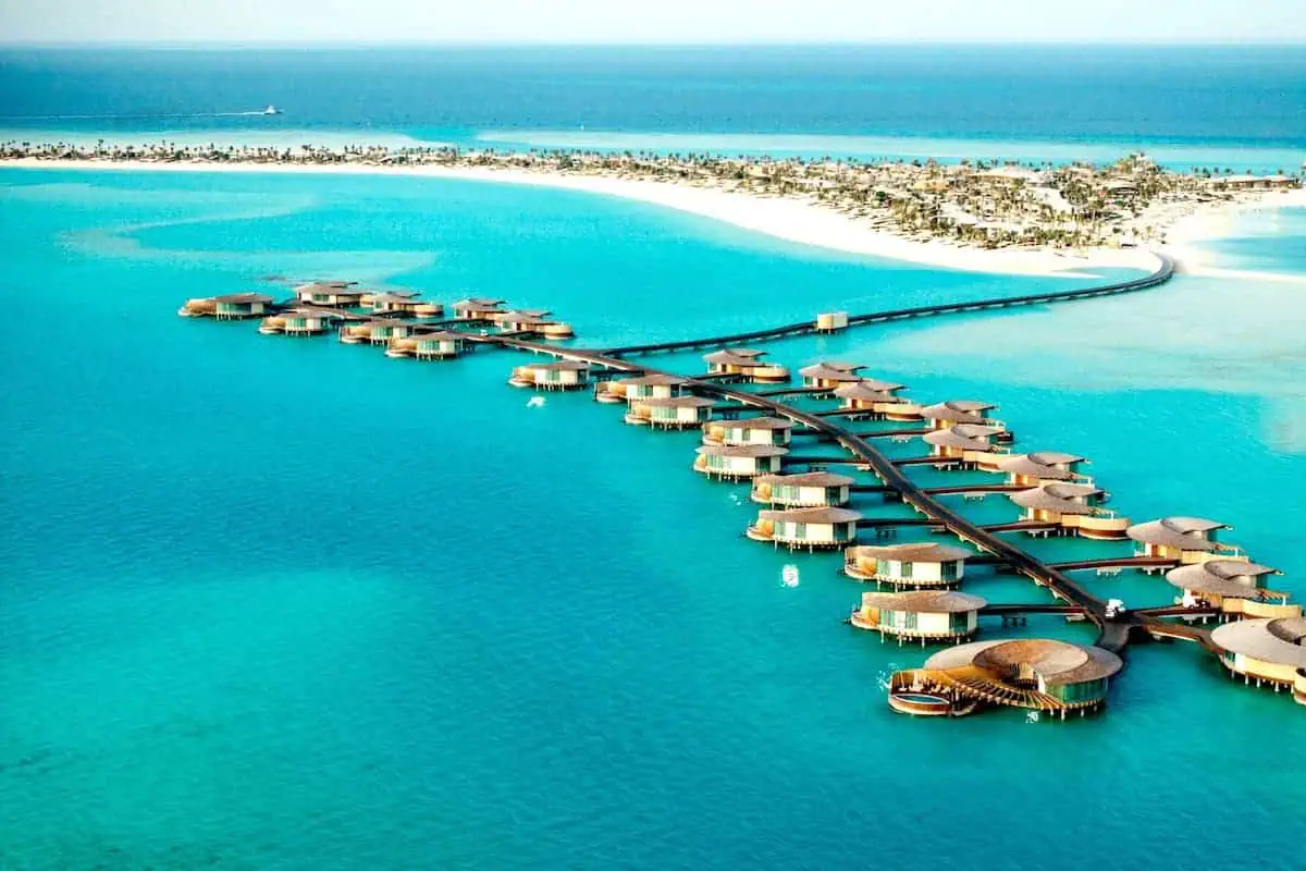 An aerial view of luxury overwater villas at The St. Regis Red Sea Resort