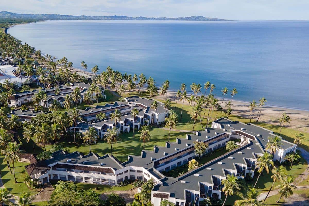 An aerial view of a large resort on the beach in Fiji