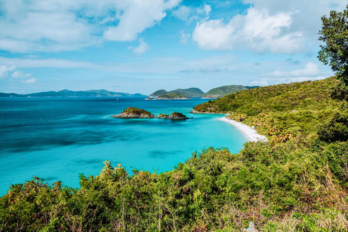 Tropical coastline in the US Virgin Islands with turquoise waters, green hills and small islands
