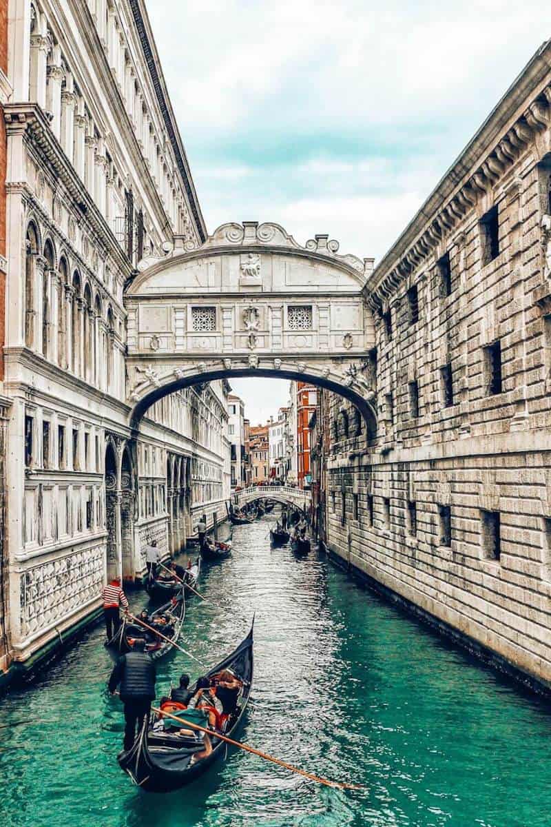Gondolas on a canal under the Bridge of Sighs in Venice