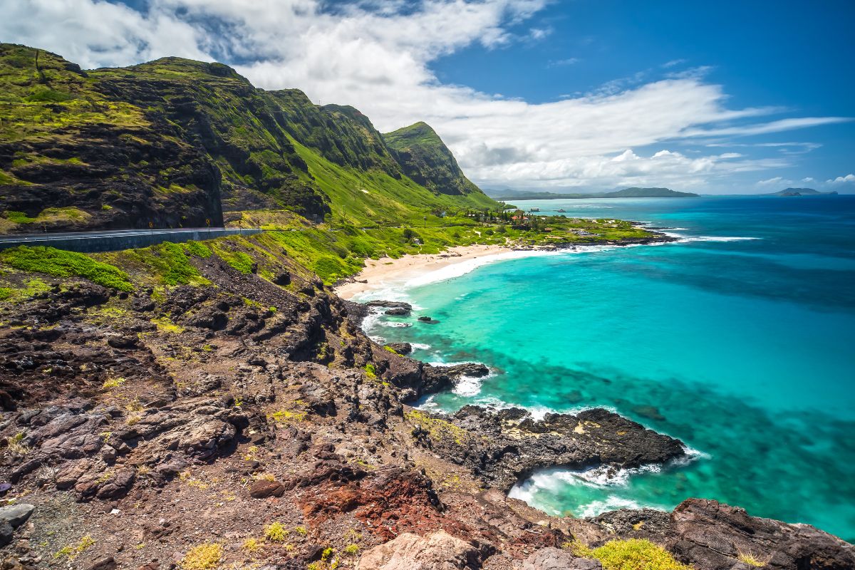 A viewpoint in Hawaii overlooking a tropical, rugged coastline