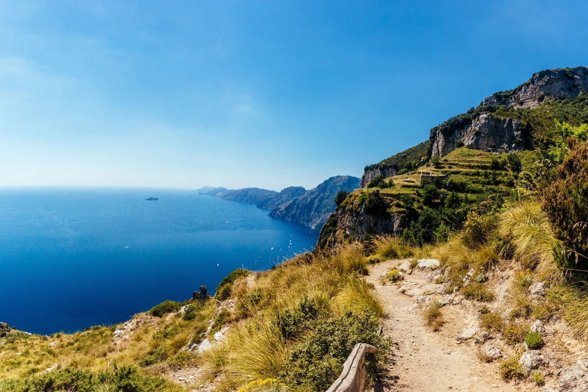 Sunny coastal scenery along the Path of the Gods hike in the Amalfi Coast, Italy