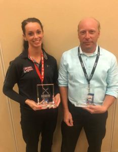 (L-R) Manager Melanie Gamble of Chickie’s & Pete’s Concourse A-West and General Manager Chris Matterson from Stellar News Concourse F accepting their trophies