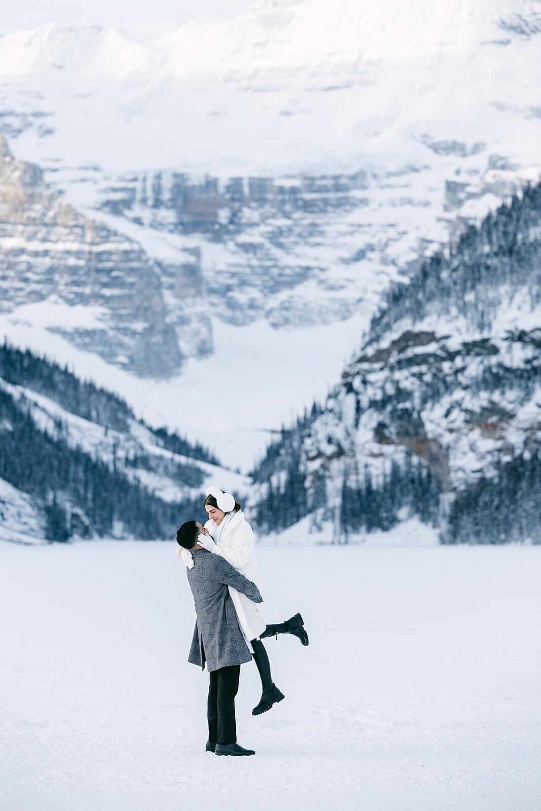 Banff engagement photographer capturing a playful and intimate moment in the mountains