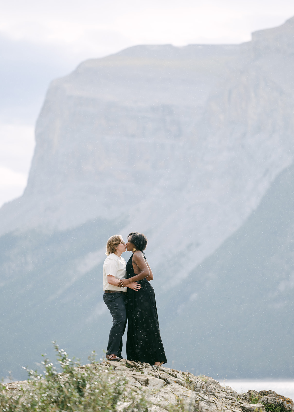 Banff engagement photographer capturing candid moments on a scenic alpine trail