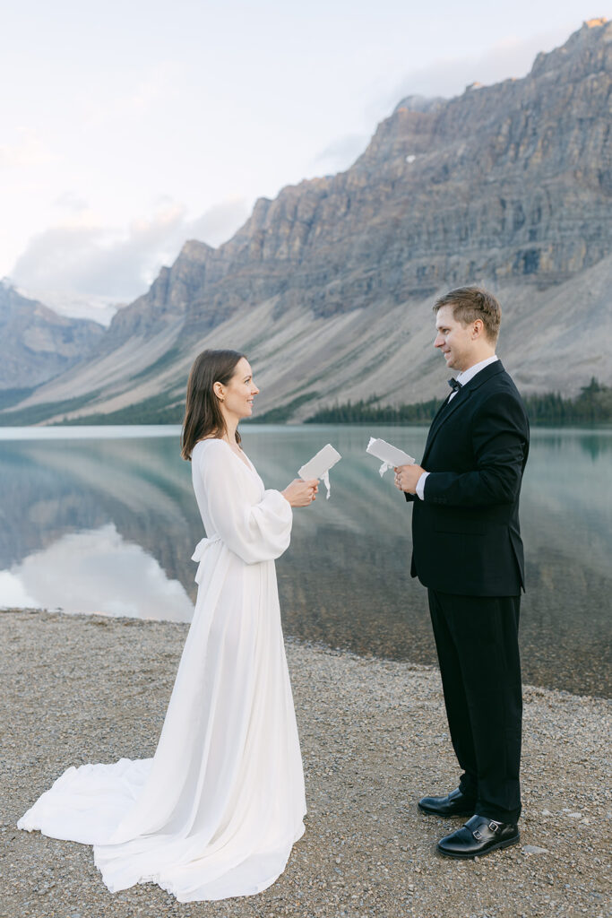Banff wedding officiants officiating a small, intimate wedding ceremony by a glacial lake