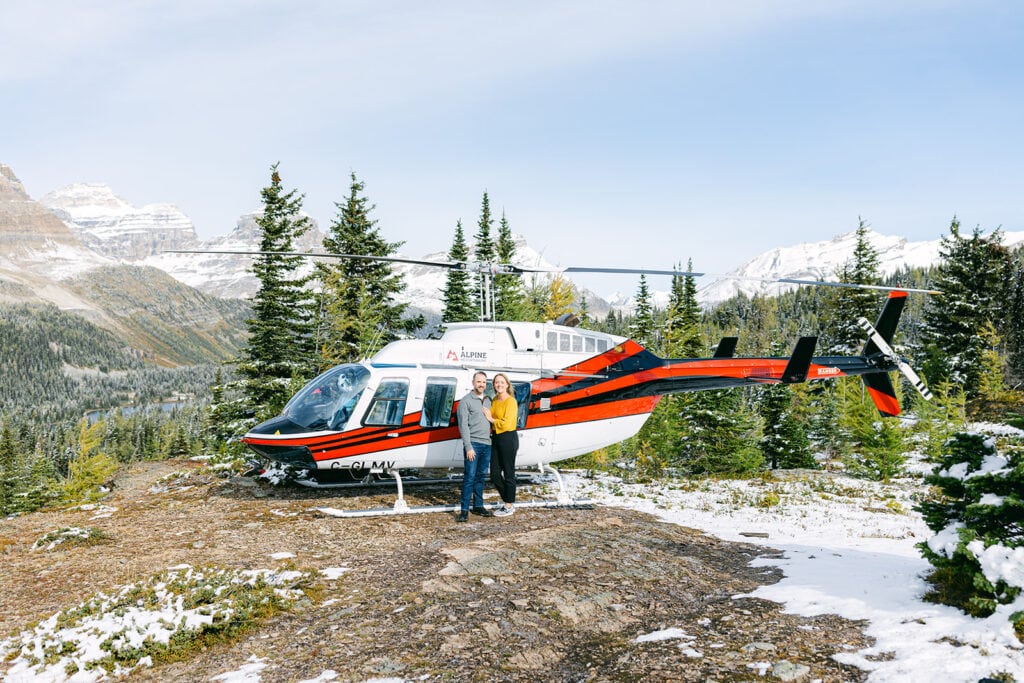 Alpine Helicopters engagement proposal with crisp mountain views and snow-capped peaks above green valleys
