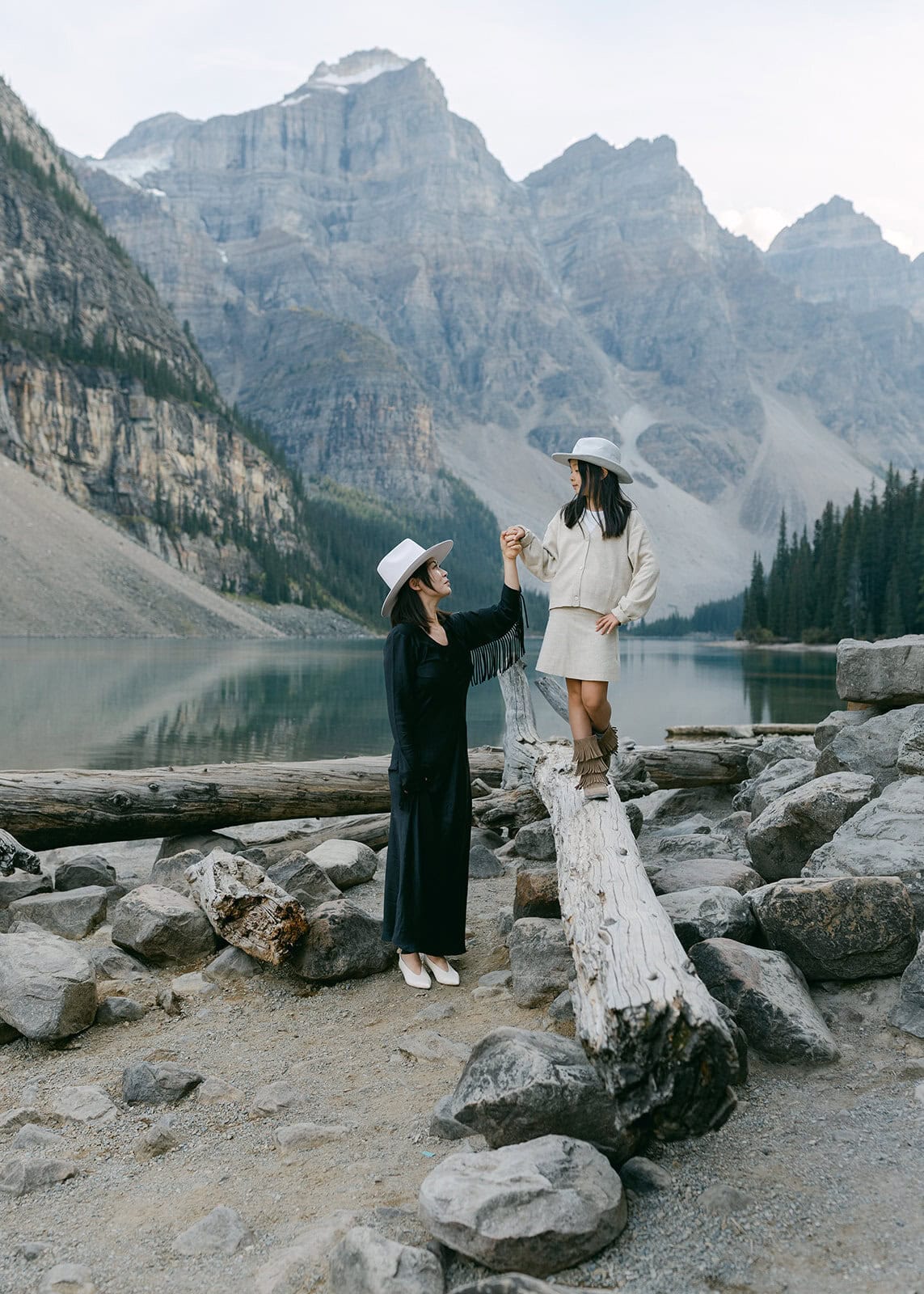 Golden hour family portraits in Banff with warm light and mountain backdrop