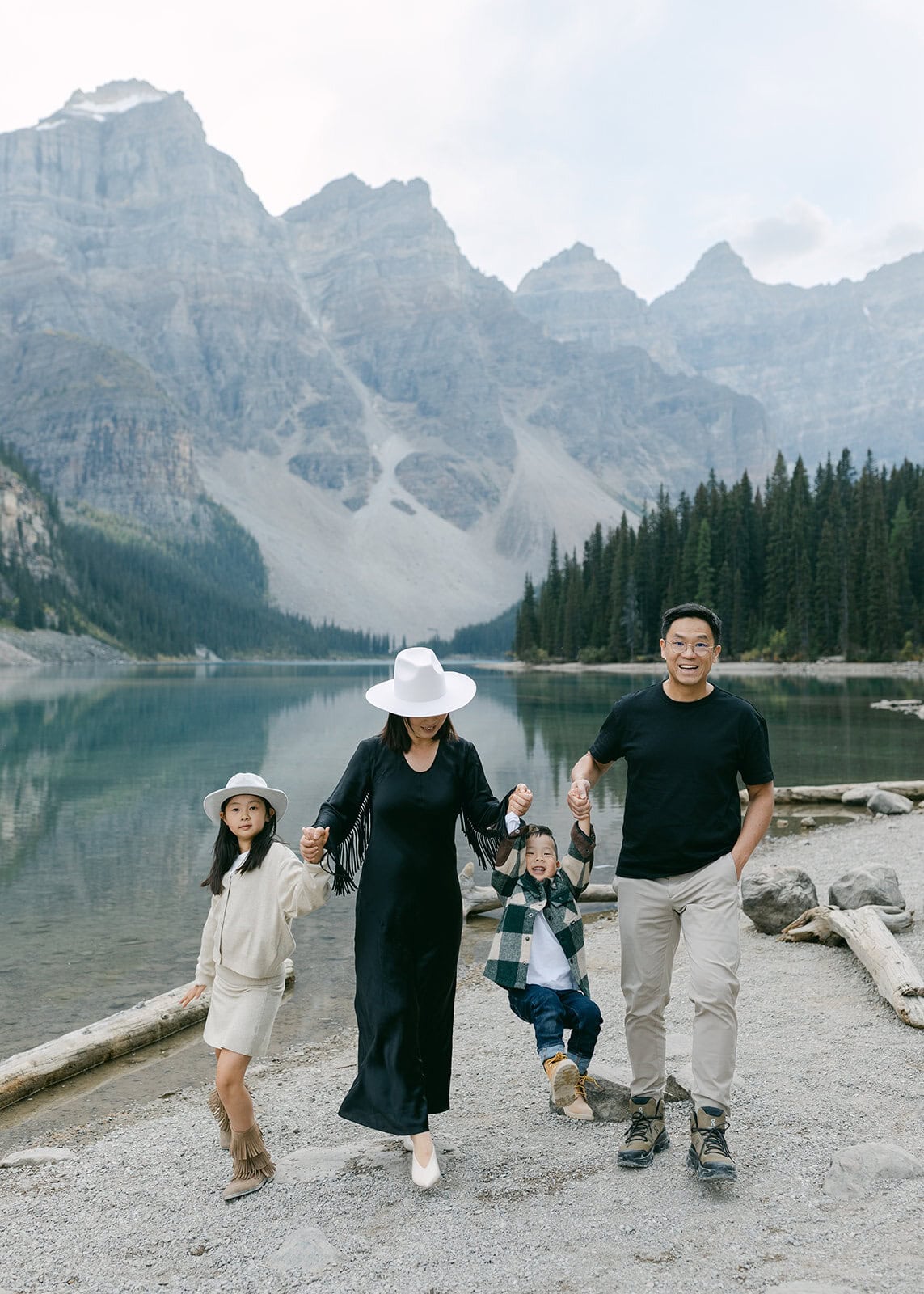 Playful family moment during an outdoor Banff family photography session in the mountains