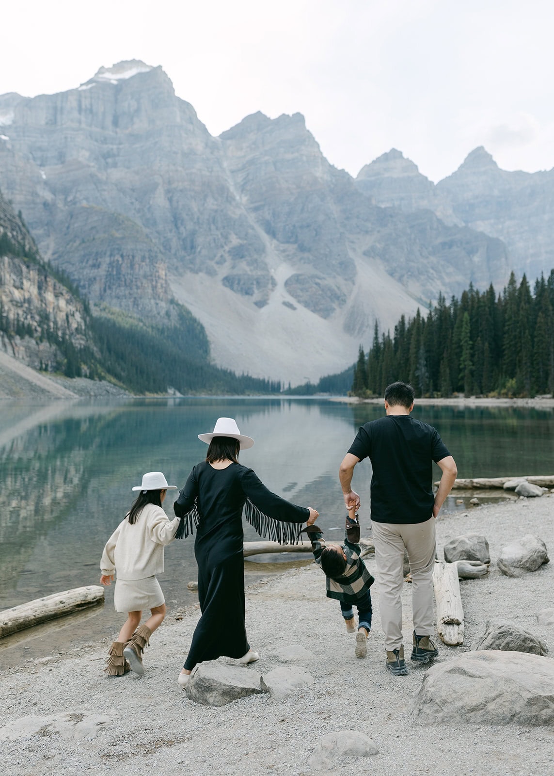 Playful family moment during an outdoor Banff family photography session in nature