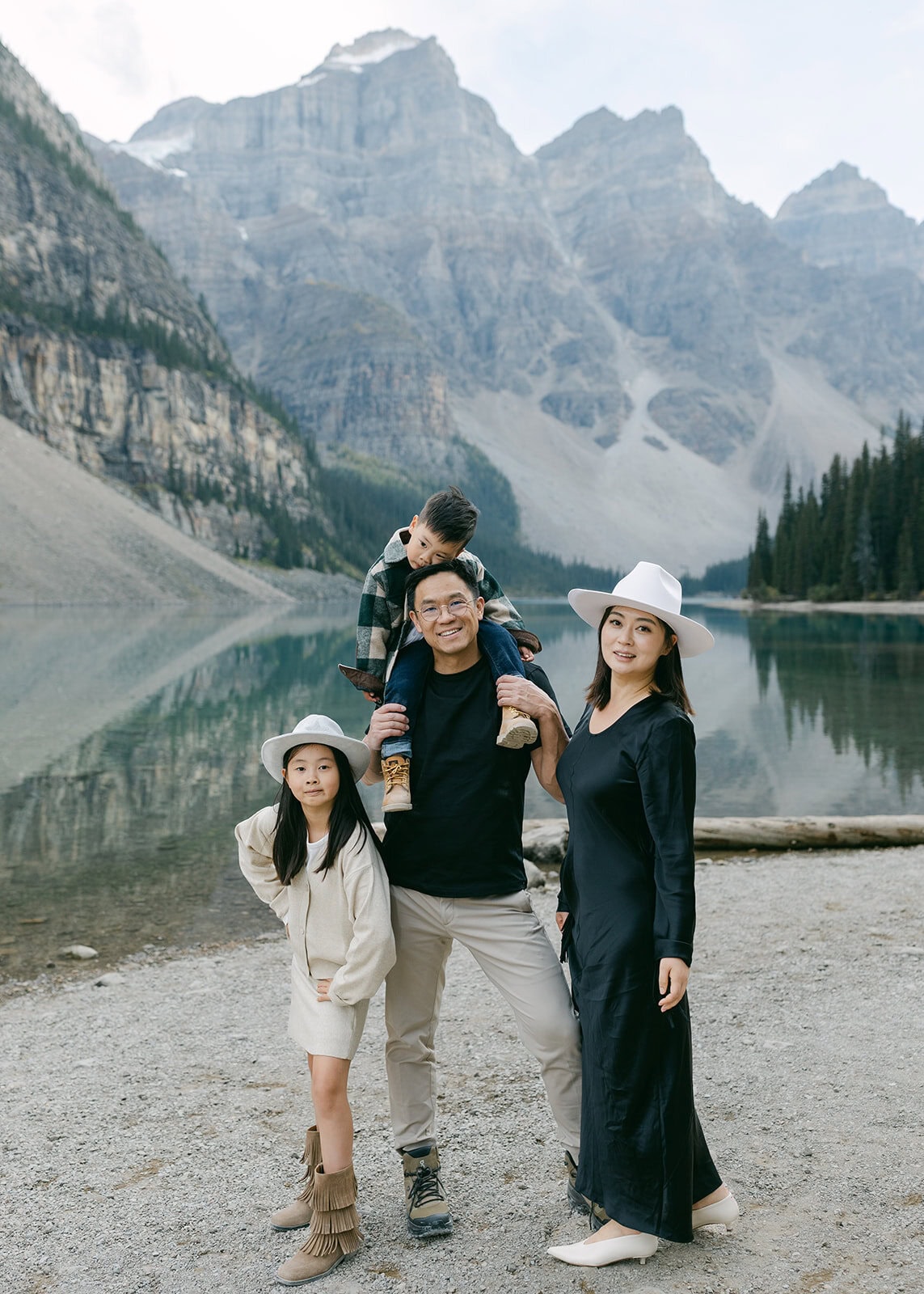 Parents holding children in a natural, relaxed moment during a Banff family photography session