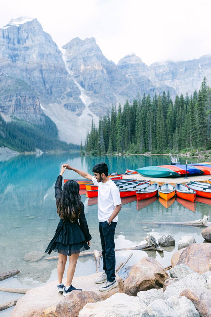 Pre-wedding shoot in Banff at Moraine Lake with dramatic mountain scenery