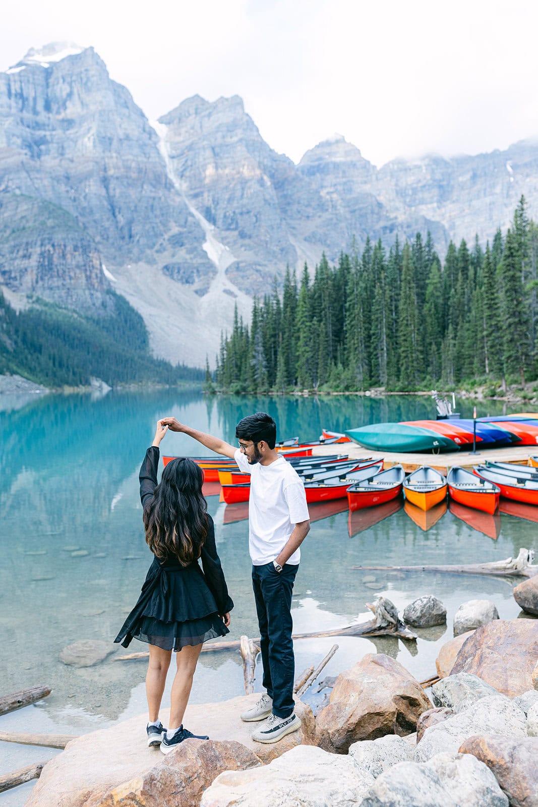 Pre-wedding shoot in Banff at Moraine Lake with dramatic mountain scenery