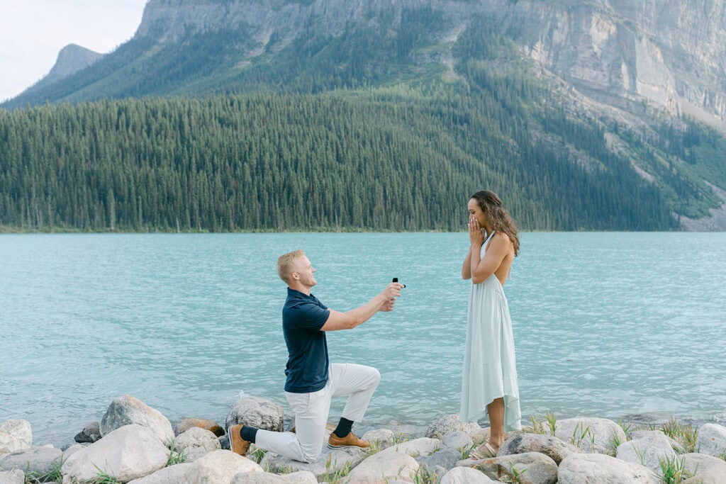 Romantic couple portraits at Moraine Lake featuring iconic turquoise lake views and misty alpine morning atmosphere