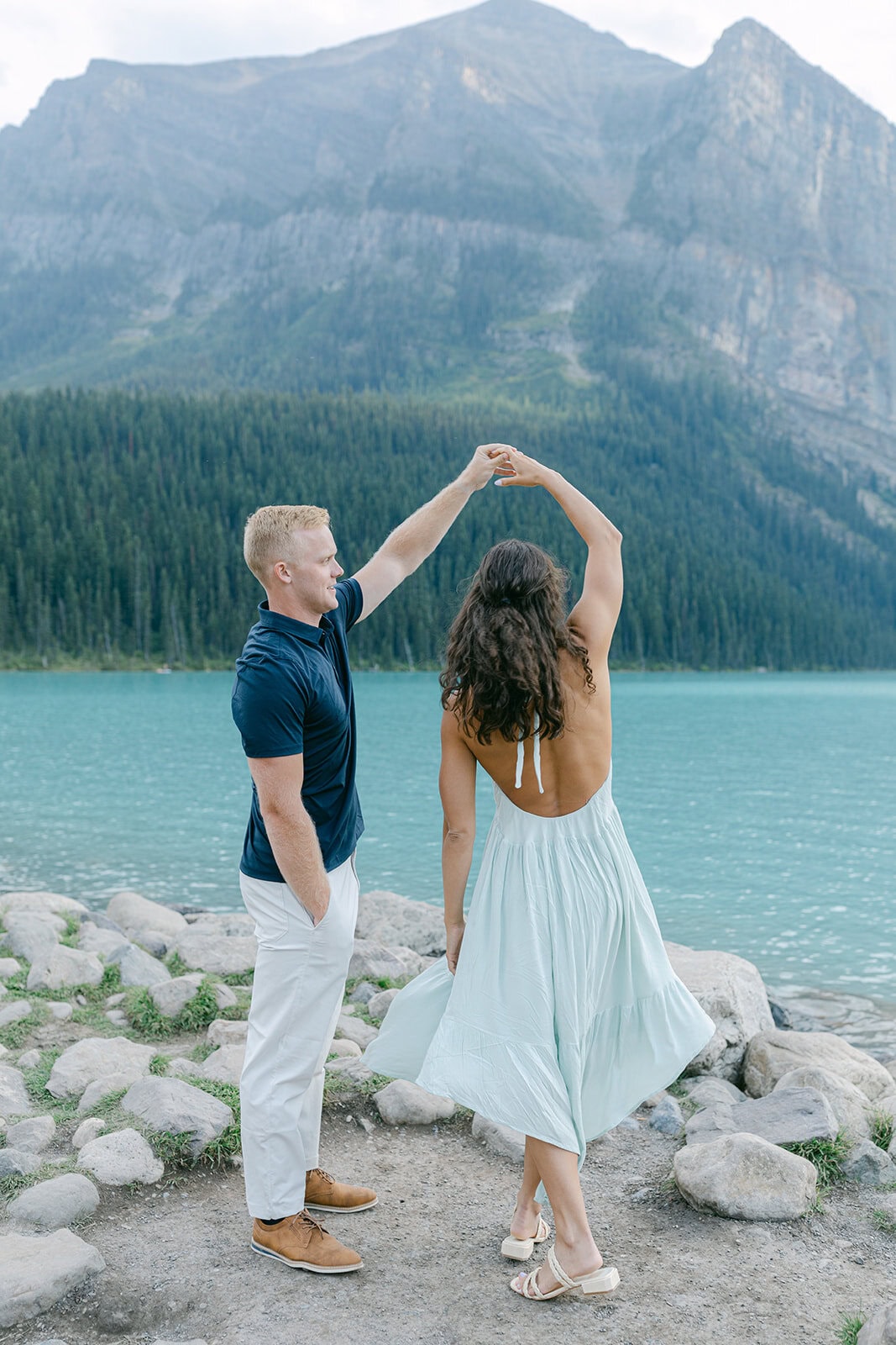 Scenic Lake Louise engagement with reflections and surrounding peaks