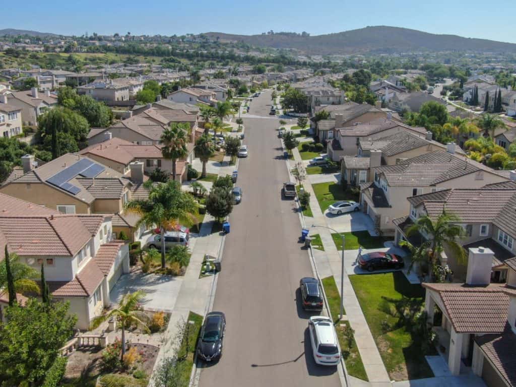 Aerial view of a suburban California neighborhood with single-family homes, representing communities impacted by the California home insurance crisis.