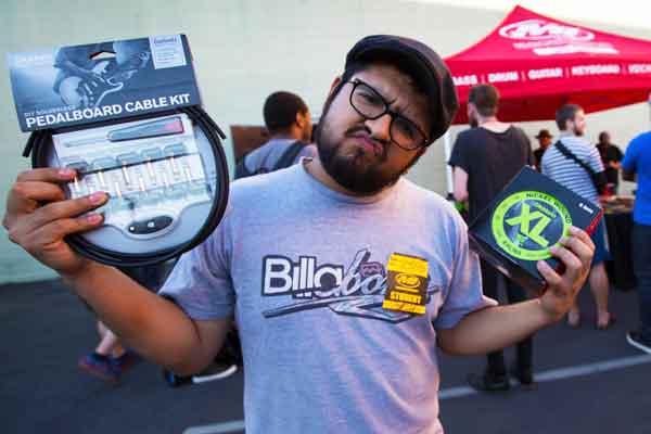 man holding pedalboard cable kit