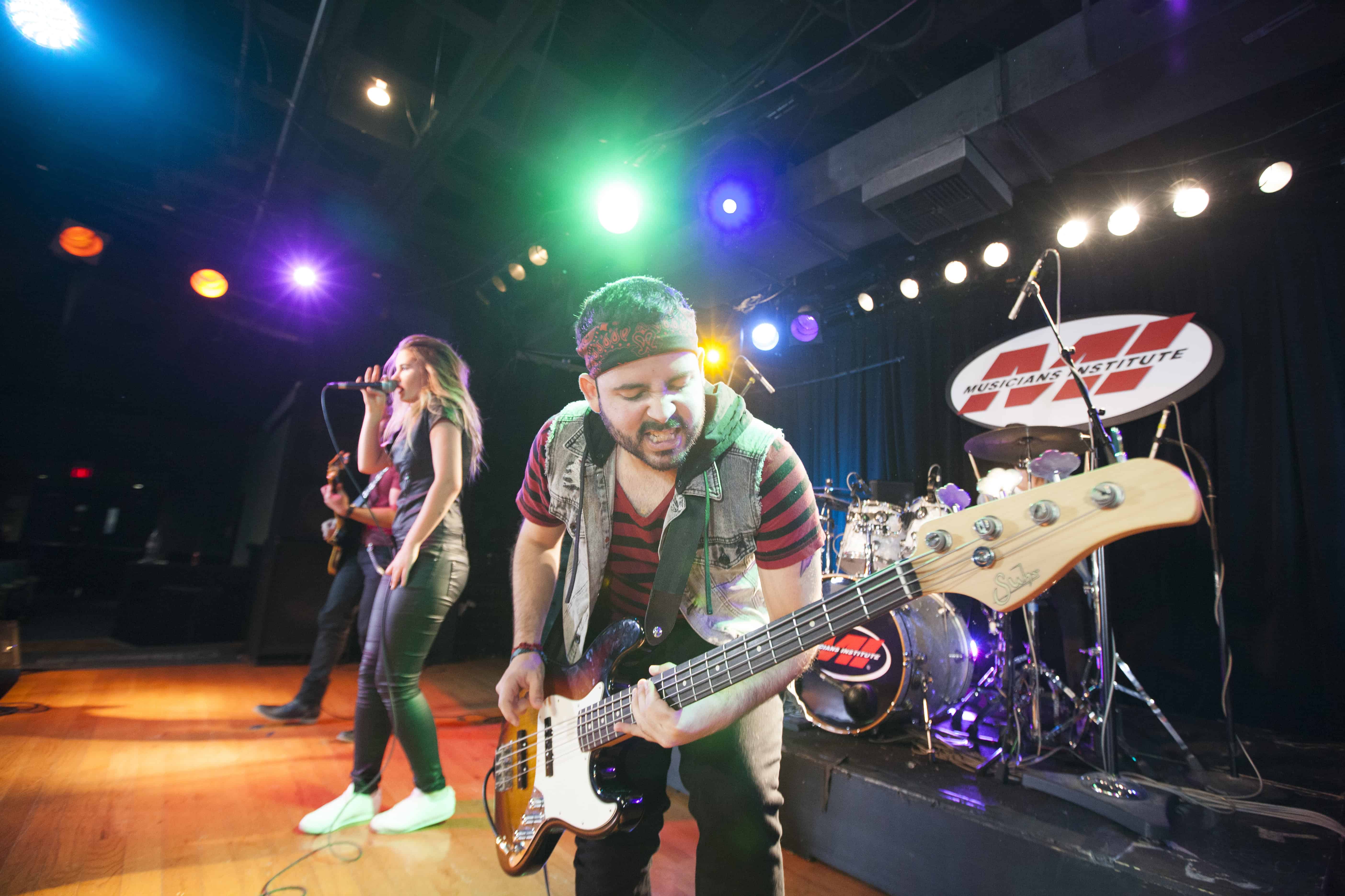 musician playing bass at a concert